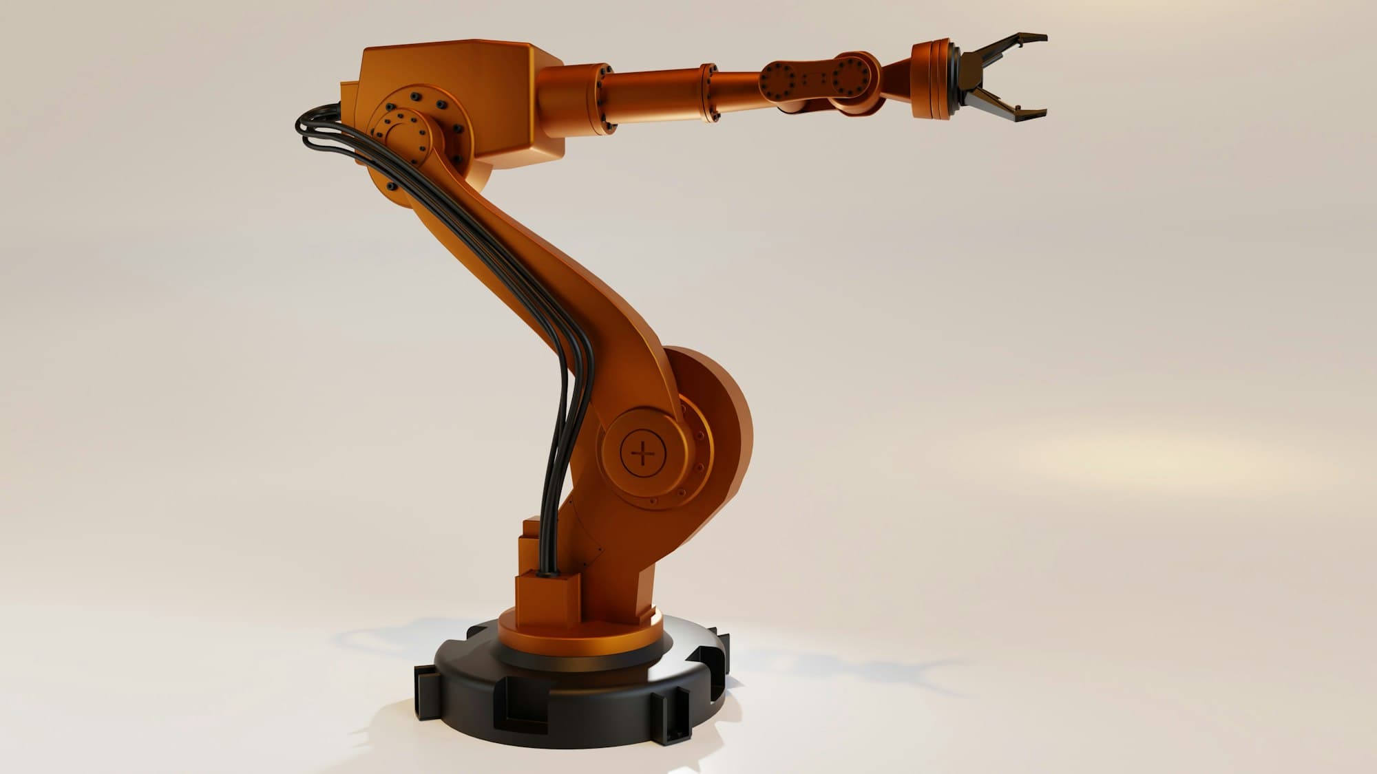 En orange robotarm mot ljus bakgrund